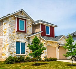 red trim around windows and nice brick homes , houses , real estate mansions and luxury living in the Suburbs of Austin , Texas , USA