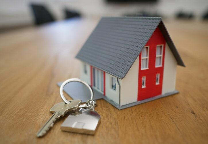 image of toy house with house keys